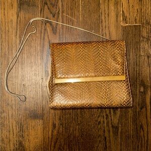 Elegant brown bag with metal strap